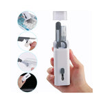 Vue latérale du kit nettoyage clavier montrant divers outils et pinceau